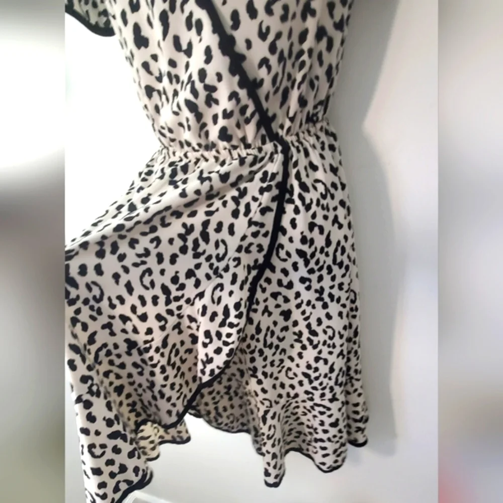 Slate & Willow Black and Cream Animal Print Midi Dress.